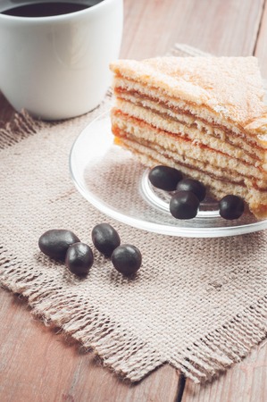 coffee, cake and peanuts on the wood background.の写真素材