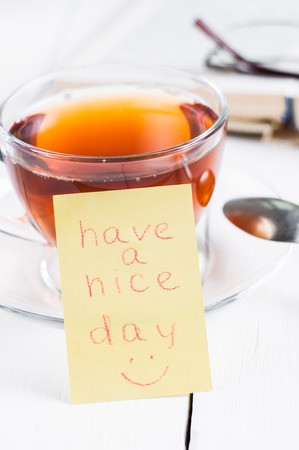 have a nice day with smile and cup tea.の写真素材
