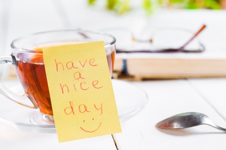 have a nice day with smile and cup tea.の写真素材