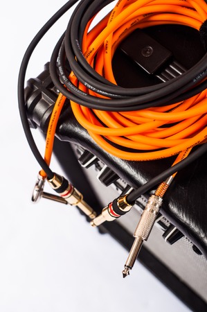 Close-up of guitar amplifier with jack cable.の写真素材
