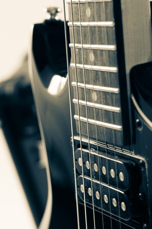 Detail of six-string electric guitar closeup, selective focus. Processed with vintage style.の写真素材