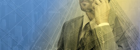 Double exposure concept with thinking businessman with phoneの写真素材