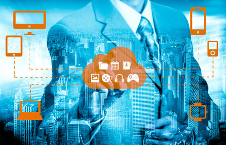 Businessman touching a cloud connected to many objects on a virtual screen, concept about internet...