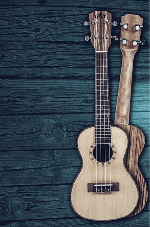 acoustic guitars on a wooden backgroundの写真素材