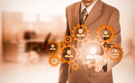 Hand carrying businessman icon network - HR,HRM,MLM, teamwork and leadership concept.の写真素材