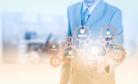 Hand carrying businessman icon network - HR,HRM,MLM, teamwork and leadership concept.の写真素材