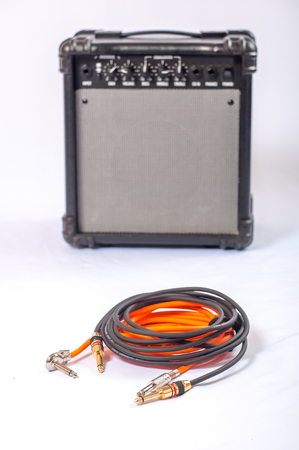 Close-up of guitar amplifier with jack cable.の写真素材