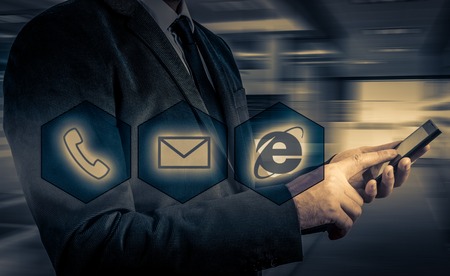 Businessman pressing phone buttons. customer support conceptの写真素材