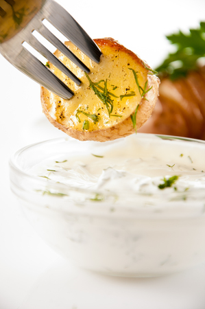 potatoes with salt pepper and cumin sauce. Roasted potato wedges crispy delicious.の写真素材