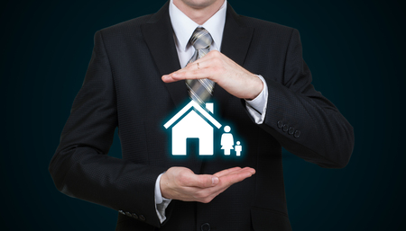 businessman protecting family Insurance concept.の写真素材