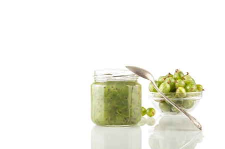 Gooseberry smoothie in a jar on a white table. Isolated.の写真素材