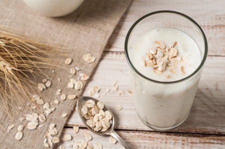 Fresh dairy products and wheat on rustic wooden background. Organic farming dairy concept.の写真素材