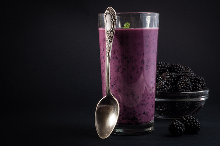 Blackberry yogurt smoothie in glass and fresh berries series.の写真素材