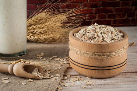 Fresh dairy products and wheat on rustic wooden background. Organic farming dairy concept.の写真素材