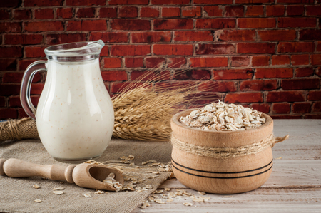 Fresh dairy products and wheat on rustic wooden background. Organic farming dairy concept.の写真素材