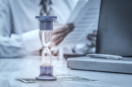 Teamwork process, Businessmen hands pointing at laptop and document during explanation of new plan project data at meeting.の写真素材