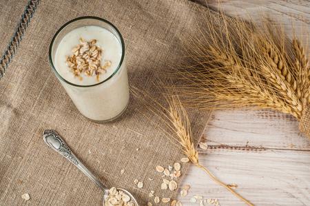 Fresh dairy products and wheat on rustic wooden background. Organic farming dairy concept.の写真素材