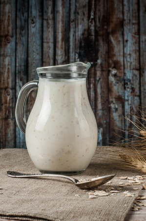 Fresh dairy products and wheat on rustic wooden background. Organic farming dairy concept.の写真素材