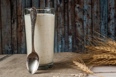 Fresh dairy products and wheat on rustic wooden background. Organic farming dairy concept.の写真素材