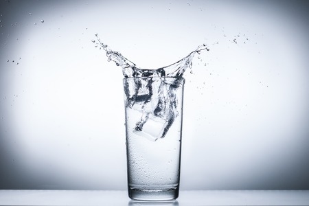 water splash in glasses isolated on white.の写真素材