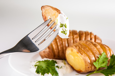 potatoes with salt pepper and cumin sauce. Roasted potato wedges crispy delicious.の写真素材