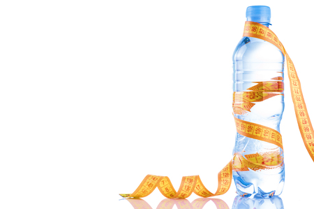 Fitnes symbols - red dumbbells, a bottle of water and a towel. The concept of a healthy lifestyle.の写真素材