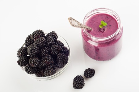 Blackberry yogurt smoothie in glass and fresh berries series.の写真素材