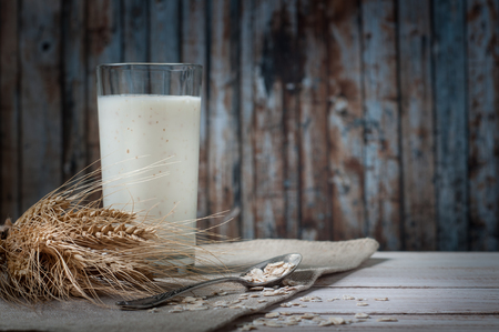 Fresh dairy products and wheat on rustic wooden background. Organic farming dairy concept.の写真素材