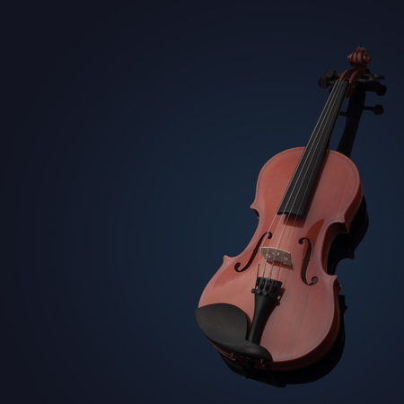 Violin musical instruments of orchestra closeup on black.の写真素材