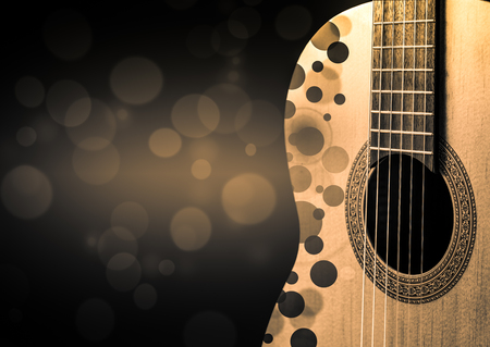 Part of an Acoustic guitar with a shadow on a gray backgroundの写真素材