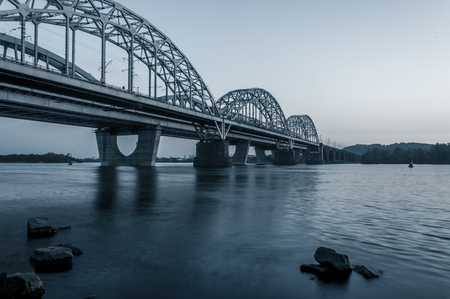 Sunset skyline and landscape of bridge over river. Evening cityの写真素材