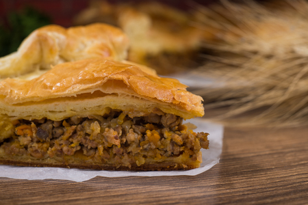 Sliced succulent meat pie with mushrooms and meatの写真素材