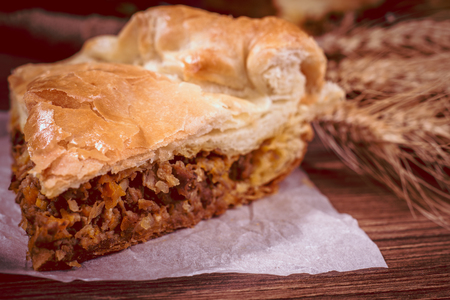 Sliced succulent meat pie with mushrooms and meatの写真素材