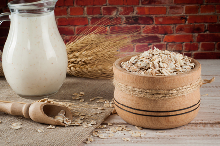 Fresh dairy products and wheat on rustic wooden background. Organic farming dairy concept.の写真素材