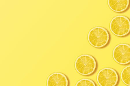 A slices of fresh juicy yellow lemons. Texture backgroundの写真素材