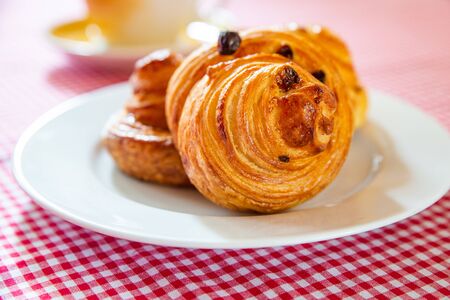 Freshly baked cinnamon buns. Sweet Homemade Pastry baking. Close-up.の写真素材
