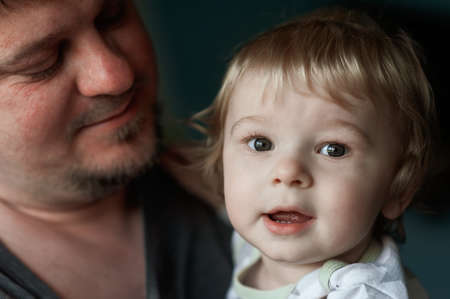 closeup portrait of dad and toddlerの写真素材