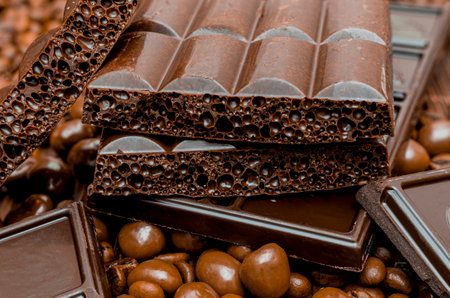 Chocolate bar and coffee beans on wooden background. Close up.の写真素材