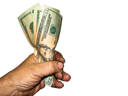 Man's hand holding dollar banknotes isolated on a white background.の写真素材
