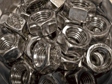 Shiny stainless steel nuts close-up. Warehouse of small parts for the assembly of various items....
