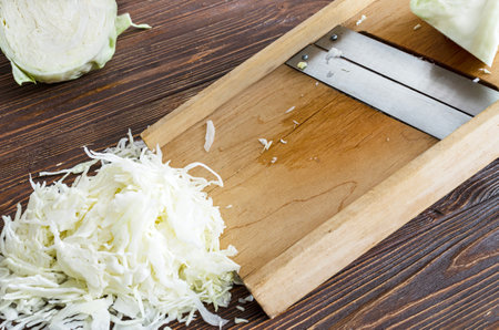 Wooden cabbage chopper, cabbage shredder, vegetable slicer blades.の写真素材