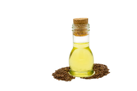 Close-up. linseed oil in bottle isolated on whiteの写真素材