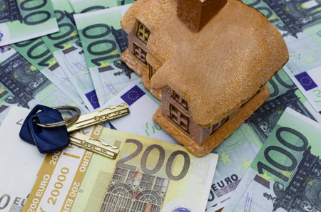 Toy house, keys and euro banknotes - wealth creation conceptの写真素材
