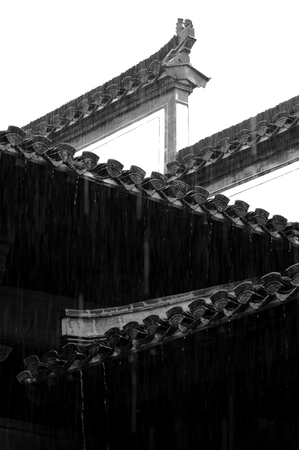 Heavy rain drifting on ancient buildings in Anhui, Chinaの写真素材