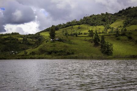 Landscape of colorful area and a lake with some houses separated each otherの写真素材