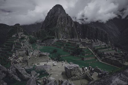Machu Picchu view with dense could in the top of their mountains around of itの写真素材