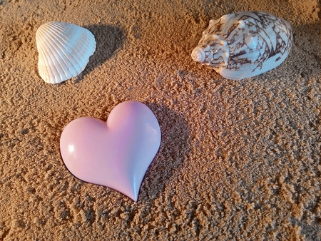 Heart symbol on beachの写真素材