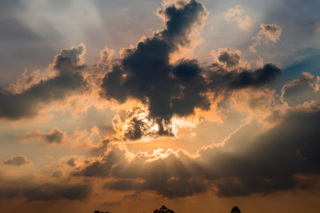 the sun when it almost sets is yellow orange and the clouds are dark