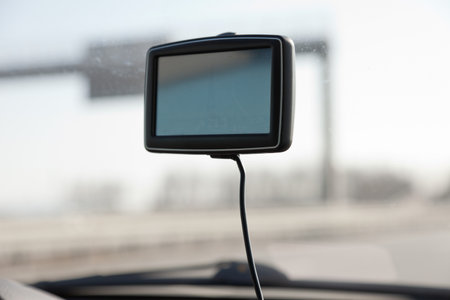 Car navigation system on front window in car.