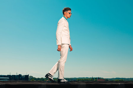 Retro fifties summer fashion man with white suit and sunglasses